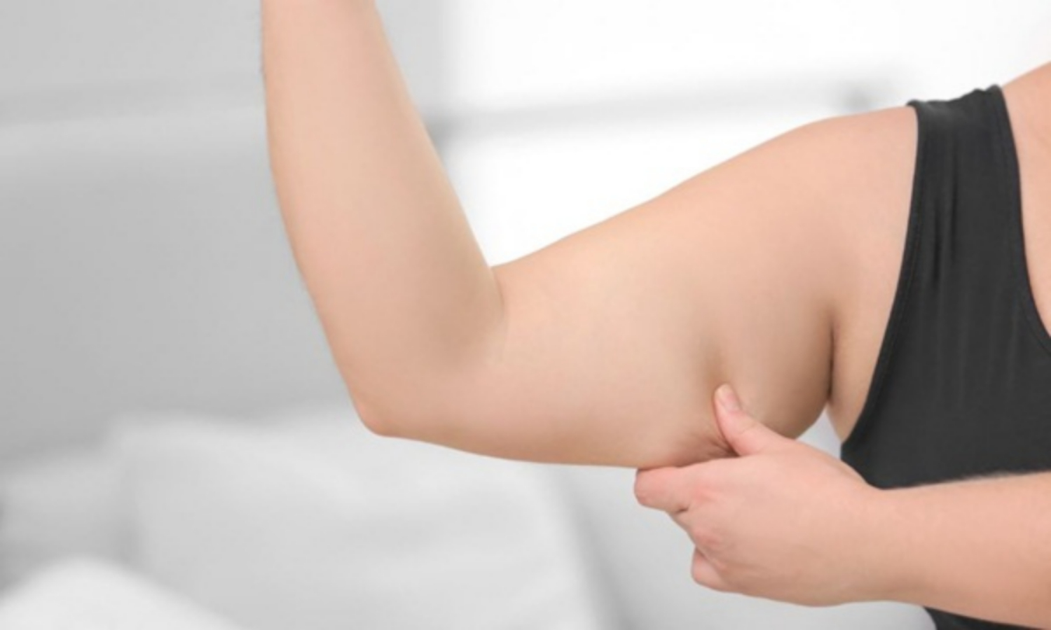 Mỡ bắp tay nhiều có thể do tăng cân đột ngột